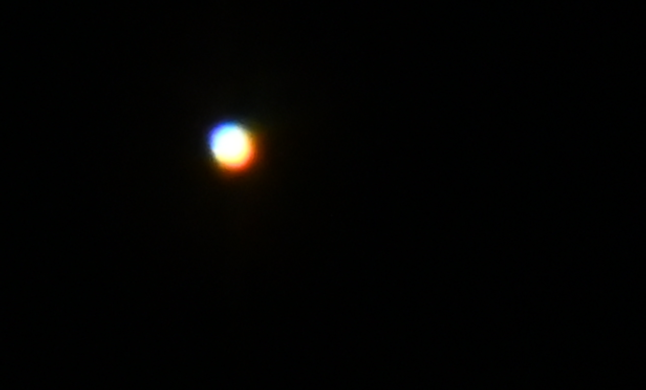 A bright white circle against a dark background