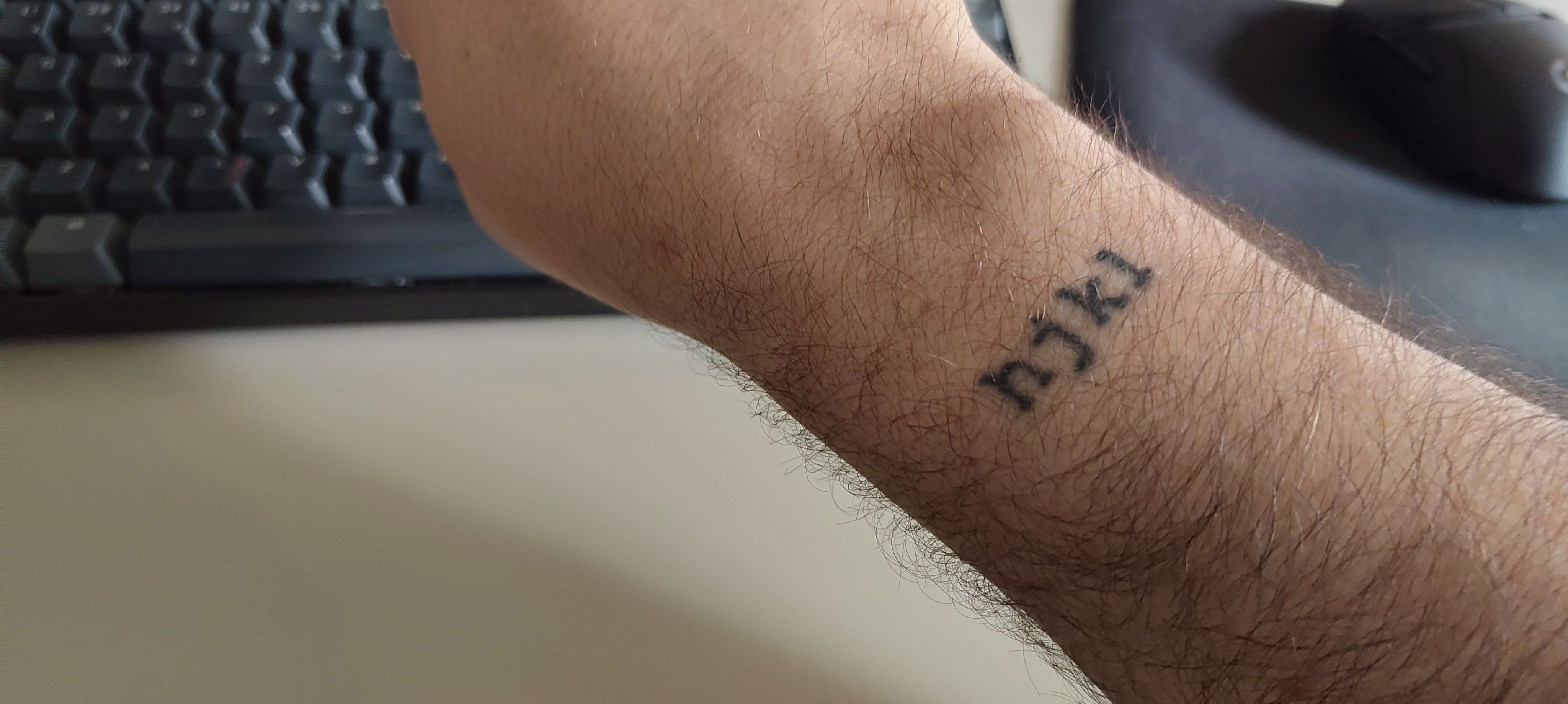 A picture of my right hand, with the letters “hjkl” tattooed on the wrist